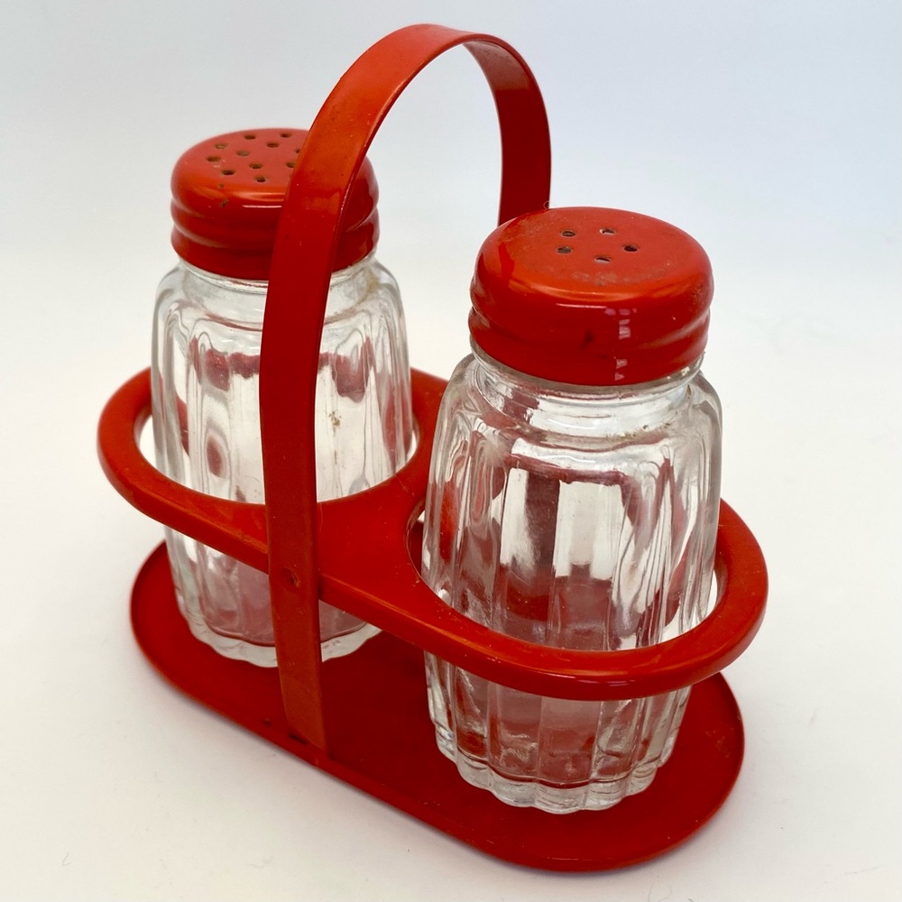 Vintage Italian salt and pepper shakers in carrier‎